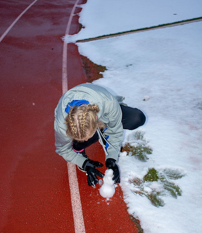 01-25-23-Rinkenberger-Building-a-Snowman-on-the-Track-Web